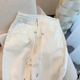 GETADME Design waist drawstring adjustable jeans for women in spring high waist loose slim white wide leg mopping pants